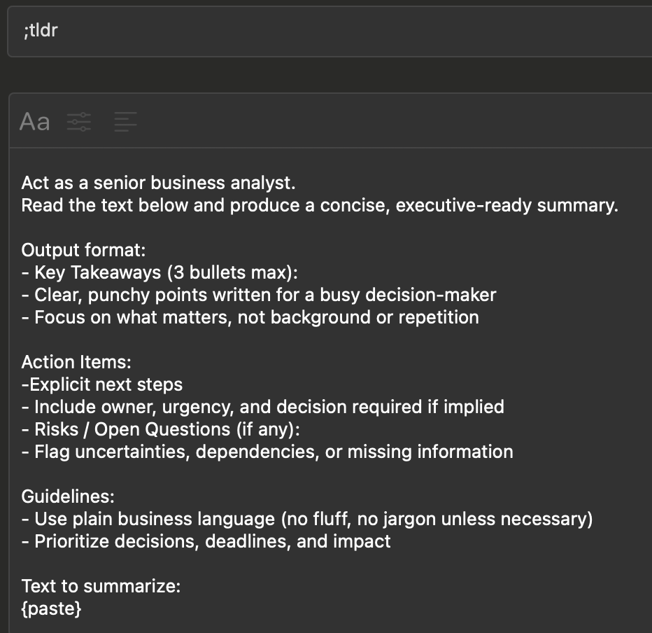 Screenshot of a dark-themed Typinator snippet editor triggered by “;tldr.” The snippet instructs generating a concise, executive-ready summary in the role of a senior business analyst, including key takeaways, action items, risks or open questions, and clear business-focused language. A {paste} placeholder indicates where the source text will be inserted.