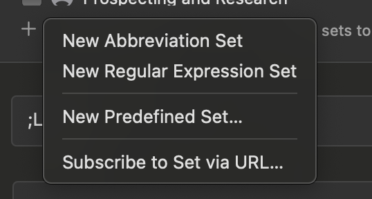Screenshot of a dark-themed Typinator interface showing a dropdown menu for creating new snippet sets. The menu includes options such as “New Abbreviation Set,” “New Regular Expression Set,” “New Predefined Set…,” and “Subscribe to Set via URL…”.