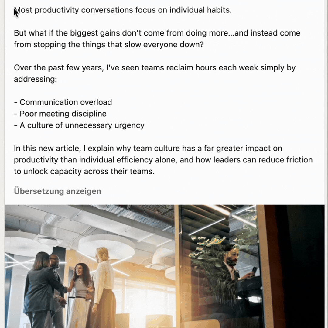 Screenshot of a social media post about productivity. The text argues that team culture, rather than individual habits, has the greatest impact, highlighting issues like communication overload, poor meeting discipline, and unnecessary urgency. Below, an office scene shows a group of four people talking together, while a man sits alone behind a glass partition looking at his phone.